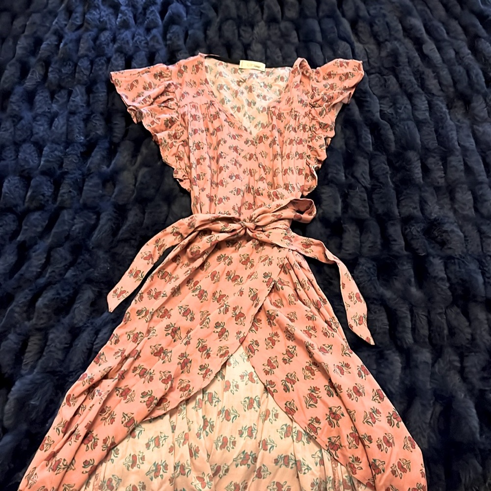 Light and flowey! Super cute wrap dress! 😊 the color is as unique as the style